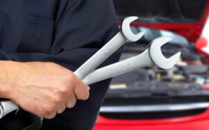 Mechanic holding spanner