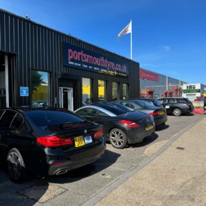 Cars having tyres fitted outside of a tyre shop business